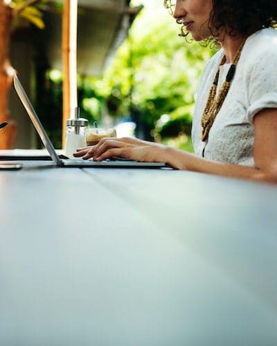 Image of a women working at her laptop computer